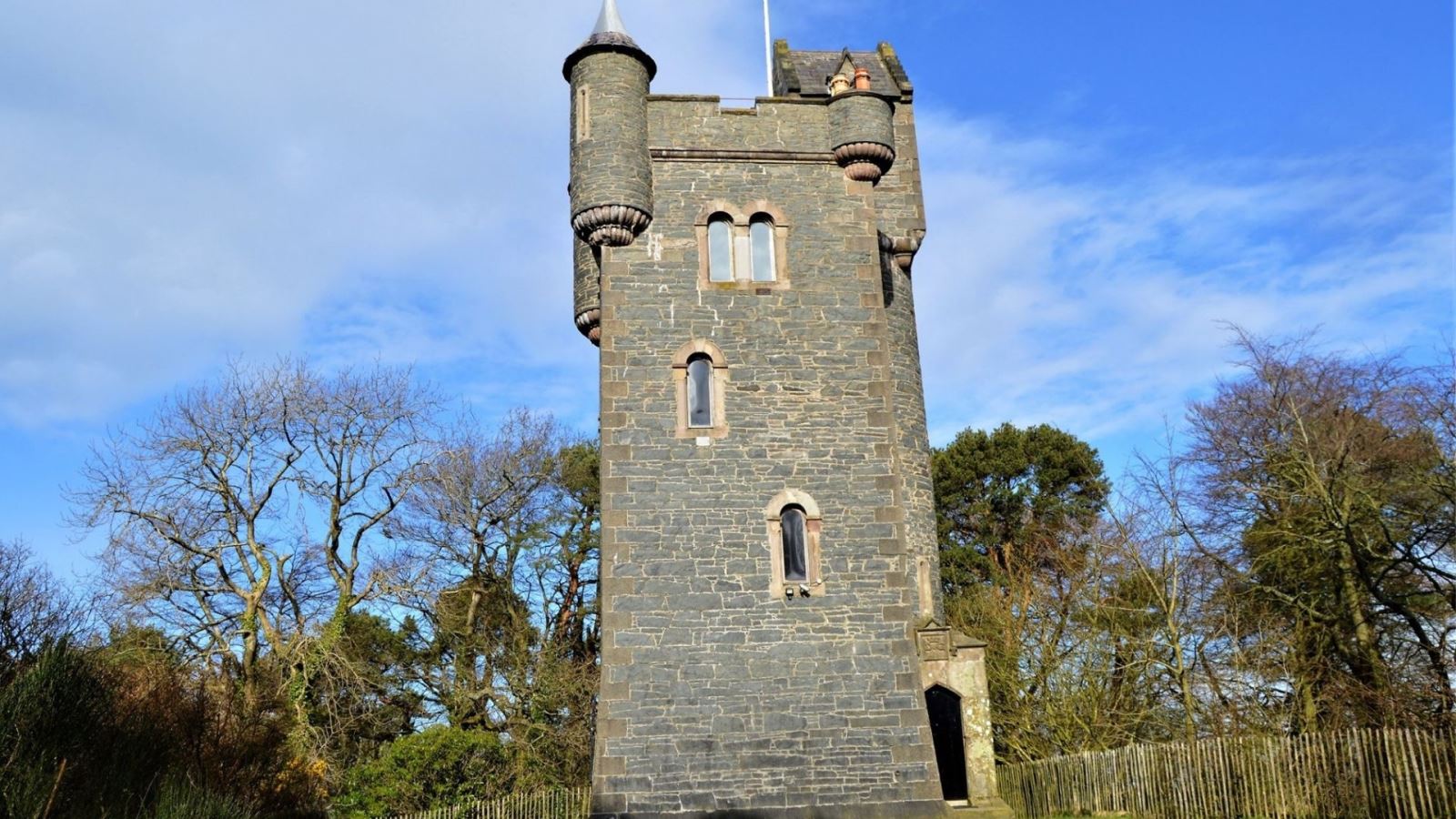 An image of Helen's Tower set amongst the woodland